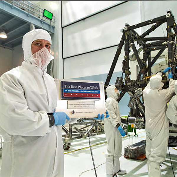 A NASA employee pauses to celebrate the agency’s Best Places to Work ranking