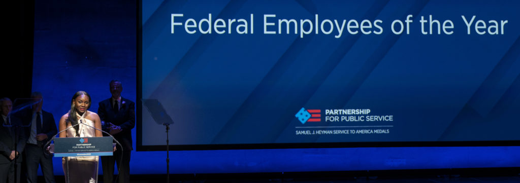 Federal Employee of the Year, Kizzmekia S. Corbett, Ph.D., accepts her award with Barney Graham